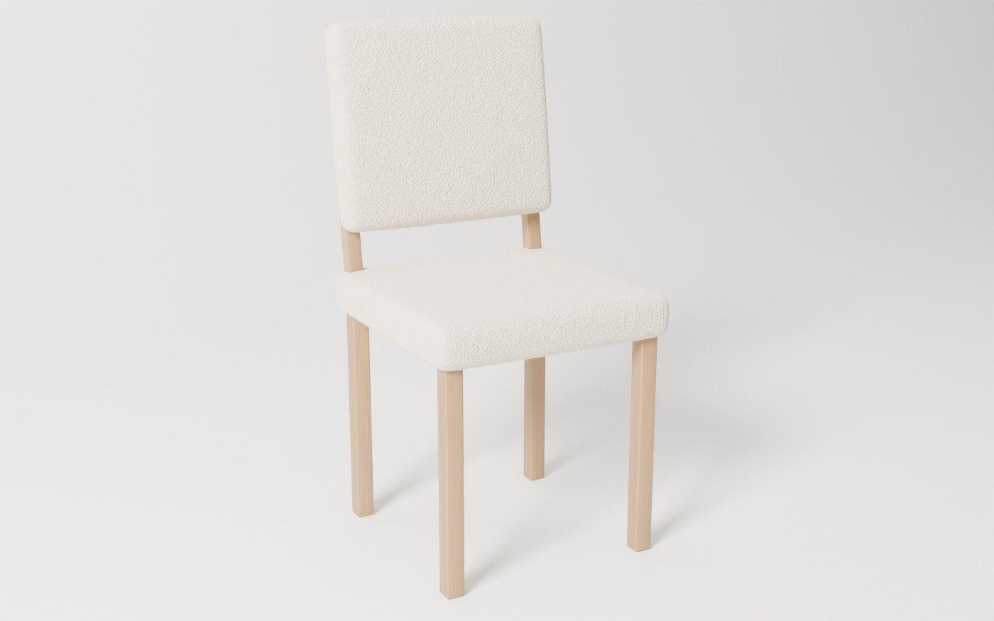 A custom upholstered dining chair with an oak frame