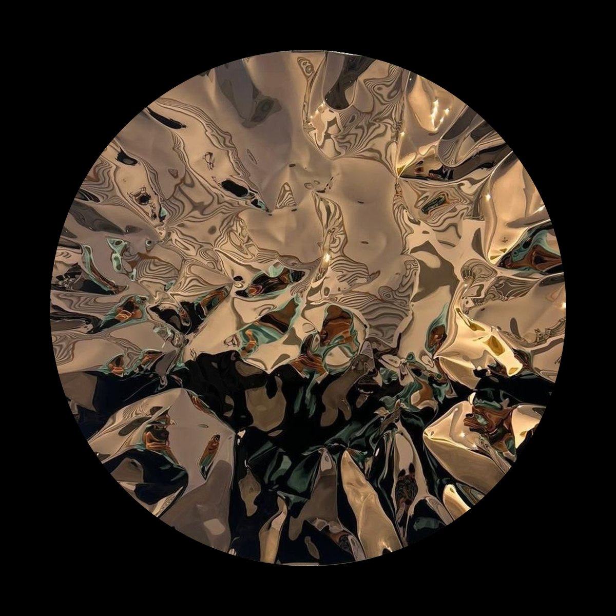 Ember by Hussain Jamil, a round bronze-toned mirror-polished stainless steel wall sculpture